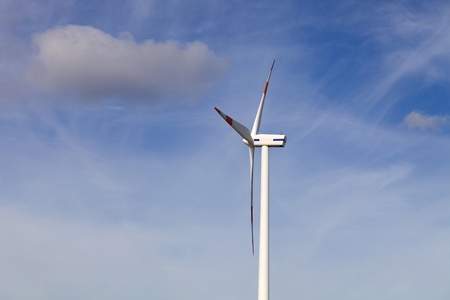 white wind turbine in the top of the mountain