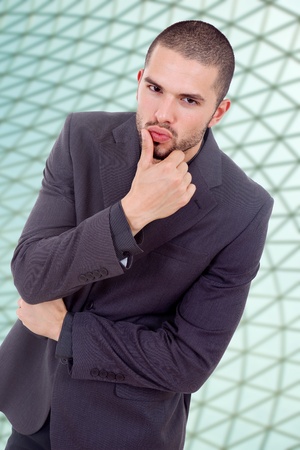 young pensive business man portrait at the officeの写真素材