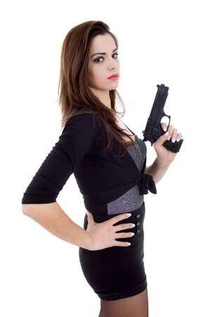 young beautiful woman with a gun, isolatedの写真素材