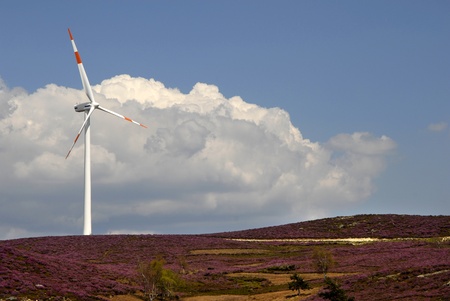 white wind turbine in the top of the mountainの写真素材