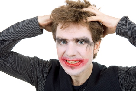 young man dressed as joker, isolated on white