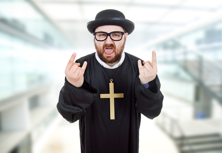 young crazy man dressed as priestの写真素材