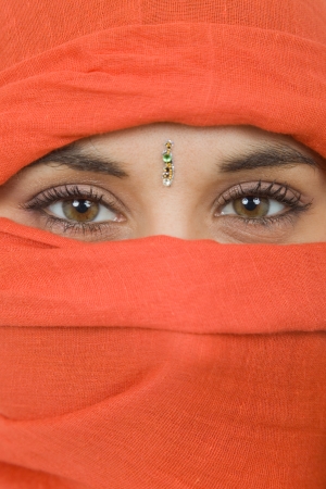 young woman with a veil, close up portrait, studio pictureの写真素材