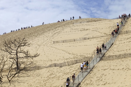People visiting the Famous dune of Pyla, the highest sand dune in Europe, on August 8, 2012 in Pyla Sur Mer, France.のeditorial素材