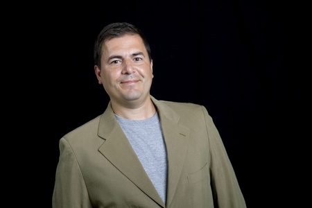 young casual man portrait on a black background