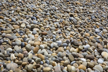 colorful pebble stone background, at the beachの写真素材