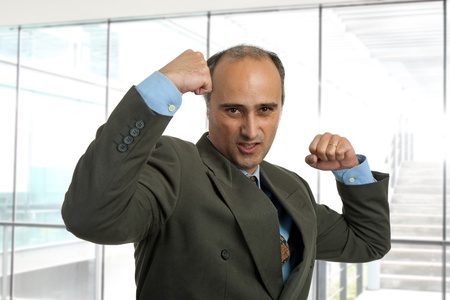 mad mature business man portrait at the office