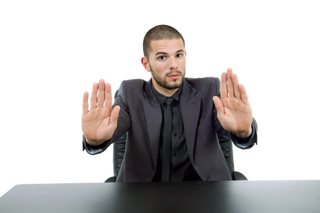 young business man on a desk, isolated on whiteの写真素材