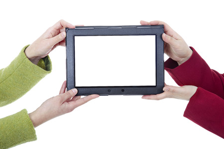 Two women with a digital tablet, isoated, detailの写真素材