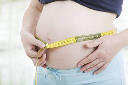 caucasian pregnant woman belly close upの写真素材