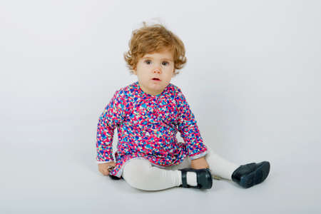 young baby portrait on a grey backgroundの写真素材