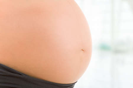 Closeup of pregnant woman belly