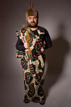 young casual silly man full length in a dark backgroundの写真素材