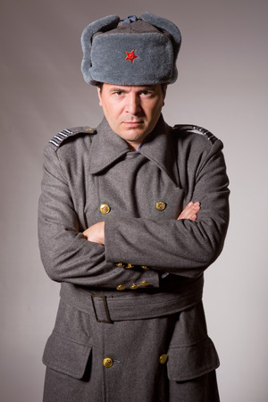 young man dressed as russian military, studio pictureの写真素材