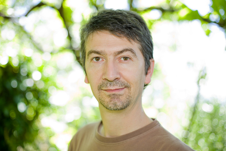 young happy casual man portrait, outdoors, bokeh picture