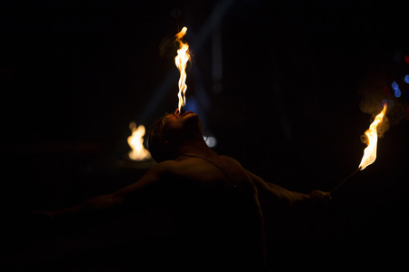 Fire eater performing at Cardinali Circus in Braga, Portugal.のeditorial素材