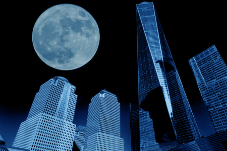 view of manhattan buildings with full moon in blue toneの写真素材