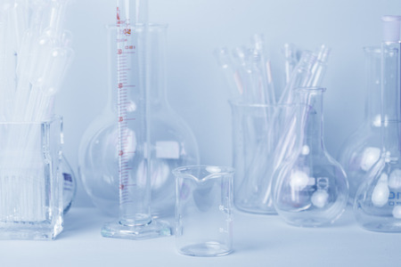 Research lab assorted glassware equipment in blue toneの写真素材