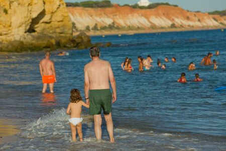 People at the famous beach of Olhos de Agua in Albufeira. This beach is a part of famous tourist region of Algarve.のeditorial素材