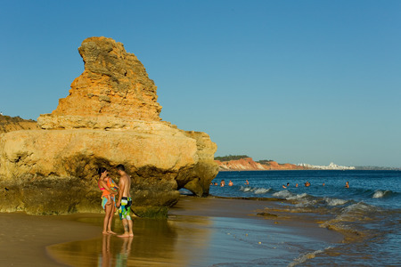 ALBUFEIRA, PORTUGAL - AUGUST 20, 2016: People at the famous beach of Olhos de Agua in Albufeira. This beach is a part of famous tourist region of Algarve.のeditorial素材