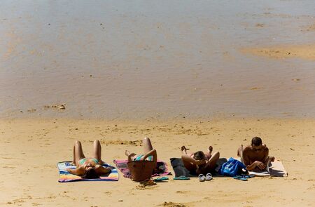 ALBUFEIRA, PORTUGAL - AUGUST 21, 2016: People at the famous beach of Olhos de Agua in Albufeira. This beach is a part of famous tourist region of Algarve.のeditorial素材
