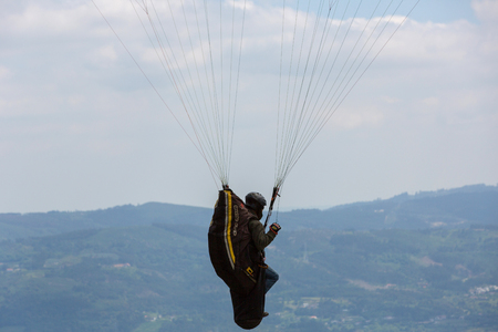 CALDELAS, PORTUGAL - JUNE 4: Paragliding Festival Aboua Cup de Caldelas 2016, in the north of Portugal, 4 June, 2016, Caldelas, Portugal.のeditorial素材