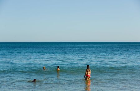 ALBUFEIRA, PORTUGAL - AUGUST 20, 2016: People at the famous beach of Olhos de Agua in Albufeira. This beach is a part of famous tourist region of Algarve.のeditorial素材