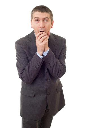 A surprised young business man isolated on whiteの写真素材
