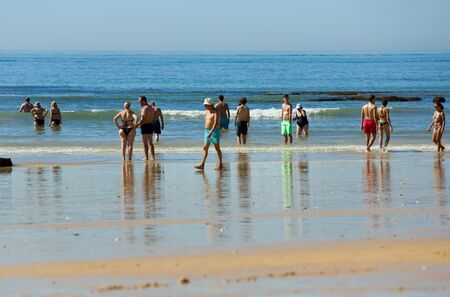 ALBUFEIRA, PORTUGAL - AUGUST 21, 2016: People at the famous beach of Olhos de Agua in Albufeira. This beach is a part of famous tourist region of Algarve.のeditorial素材