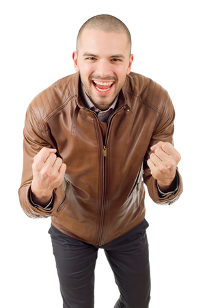 happy young man winning with open arms, isolated on white backgroundの写真素材
