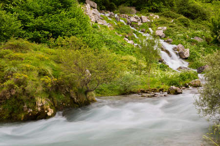 Waterfall in the Cares River located in the Picos de Europa National Park, Spain. Low shutter speed...