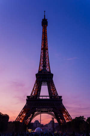 View of Eiffel tower, view from Champ de Mars in the twilight with a blue sky in a background, in Paris, France.のeditorial素材