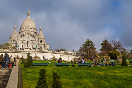 PARIS, FRANCE: Sacre-Coeur church, Paris citiscape view over the roofs with dramatic winter sky. Franceのeditorial素材
