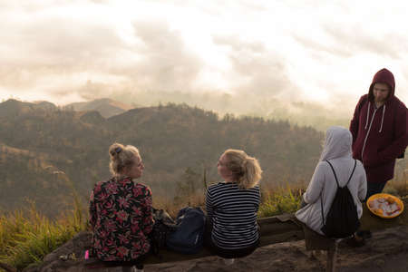 BALI, INDONESIA: Group of young people watch the dawn on top of the Batur volcano in Bali, Indonesia.のeditorial素材