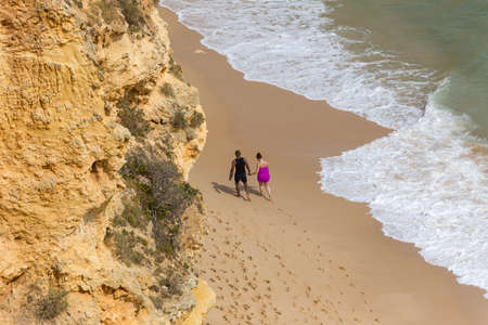 PRAIA DA MARINHA, PORTUGAL: People at the famous beach of Praia da Marinha in Lagoa. This beach is a part of famous tourist region of Algarve.のeditorial素材