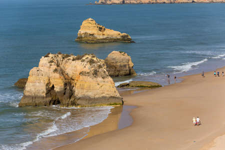 PRAIA DA ROCHA, PORTUGAL: People at the famous beach of Praia da Rocha in Portimao. This beach is a part of famous tourist region of Algarve.のeditorial素材