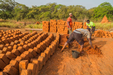 Workers making bricks of the land, outside bissau, Guinea Bissau