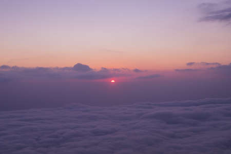 Scenic view of clouds and mist at sunrise from the top of mount Batur (Kintamani volcano), Bali, Indonesiaの写真素材