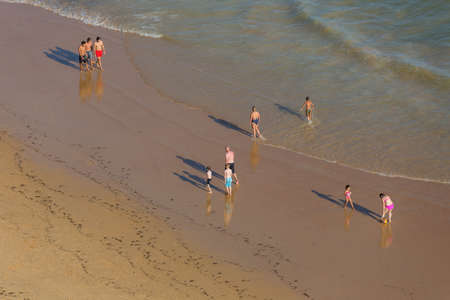 ALBUFEIRA, PORTUGAL: People at the famous beach of Praia da Felesia in Albufeira. This beach is a part of famous tourist region of Algarve.のeditorial素材