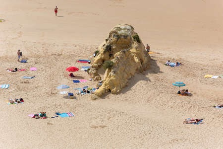 PRAIA DA ROCHA, PORTUGAL: People at the famous beach of Praia da Rocha in Portimao. This beach is a part of famous tourist region of Algarve.のeditorial素材