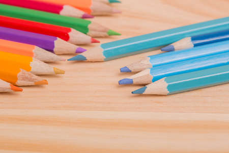 Wooden colorful pencils, on wooden table