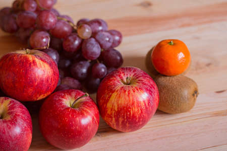 Autumn fruits on a wooden table, studio pictureの写真素材