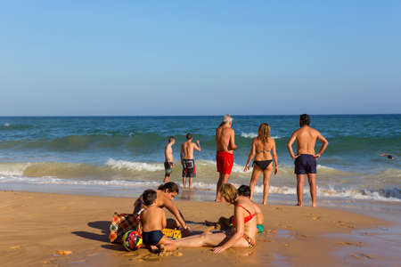 ALBUFEIRA, PORTUGAL: People at the famous beach of Olhos de Agua in Albufeira. This beach is a part of famous tourist region of Algarve.のeditorial素材