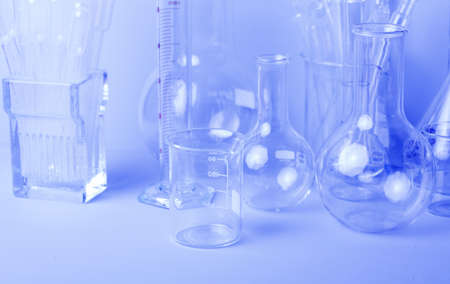 Research lab assorted glassware equipment in blue toneの写真素材