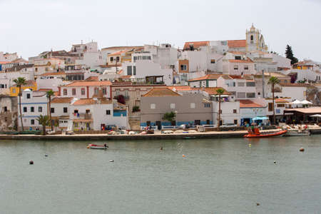 FERRAGUDO, PORTUGAL: Picturesque view of Ferragudo fishing village in Algarve, Portugalのeditorial素材