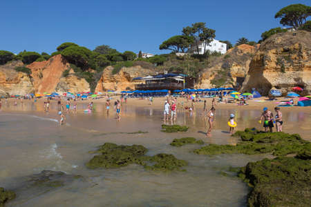 ALBUFEIRA, PORTUGAL: People at the famous beach of Olhos de Agua in Albufeira. This beach is a part of famous tourist region of Algarve.のeditorial素材