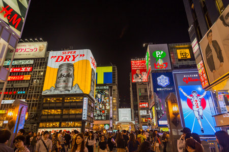 Osaka, Japan: Dotonboti street in Namba is the best sightseeing attraction and famous place in Osaka with colorful and billboard light around area in Osaka, Japanのeditorial素材