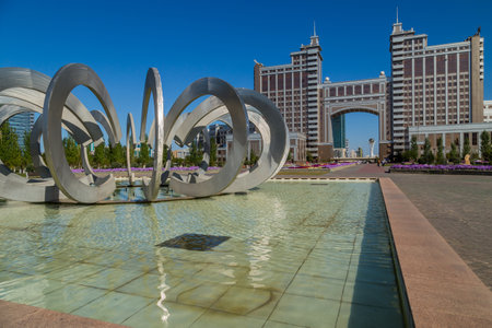 Nur-Sultan, Kazakhstan - New business district with traffic on road and park with fountain in the capital of Kazakhstan. Astana.のeditorial素材