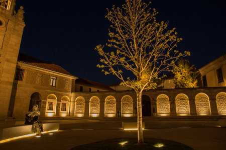 Night view of square in the front of Santa Teresa Convent in Avila, Spain