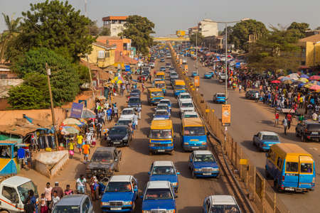 Bissau, Republic of Guinea-Bissau: Street scene in the city of Bissau with cars in a road, Guinea Bissauのeditorial素材